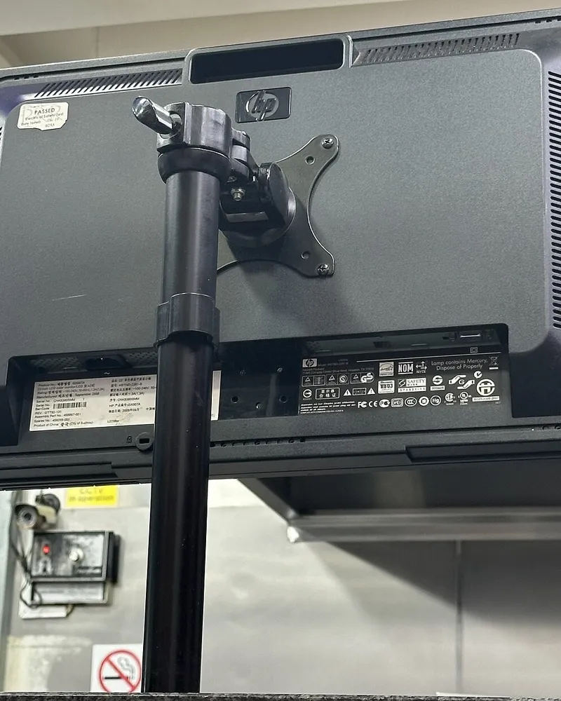 Illustrative photo of monitor arm / setup, not the exact ErGear Monitor Arm