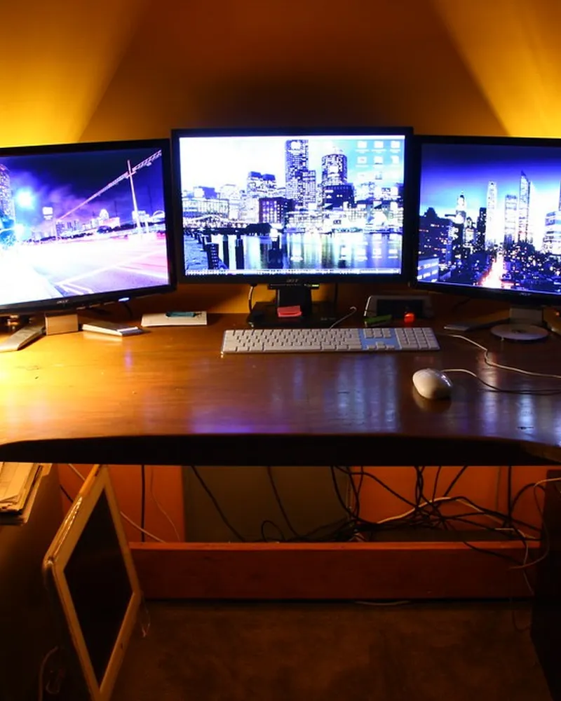 Illustrative photo of monitor arm / setup, not the exact Amazon Basics Single Monitor Arm