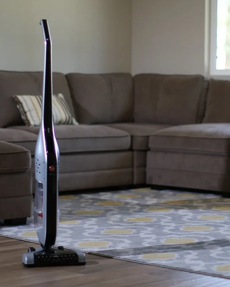 Illustrative photo of a stick vacuum, not the exact Dyson V12 Detect Slim