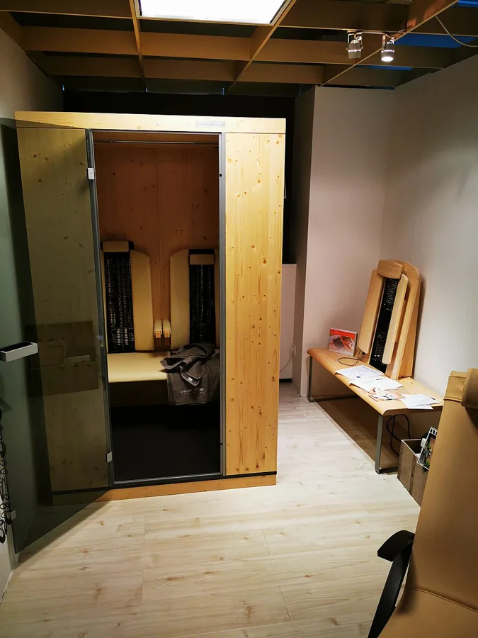 Illustrative photo of a home sauna, not the exact Sunlighten mPulse Smart Sauna Aspire