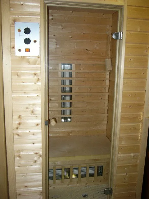 Illustrative photo of a home sauna, not the exact HigherDOSE Infrared Sauna Blanket